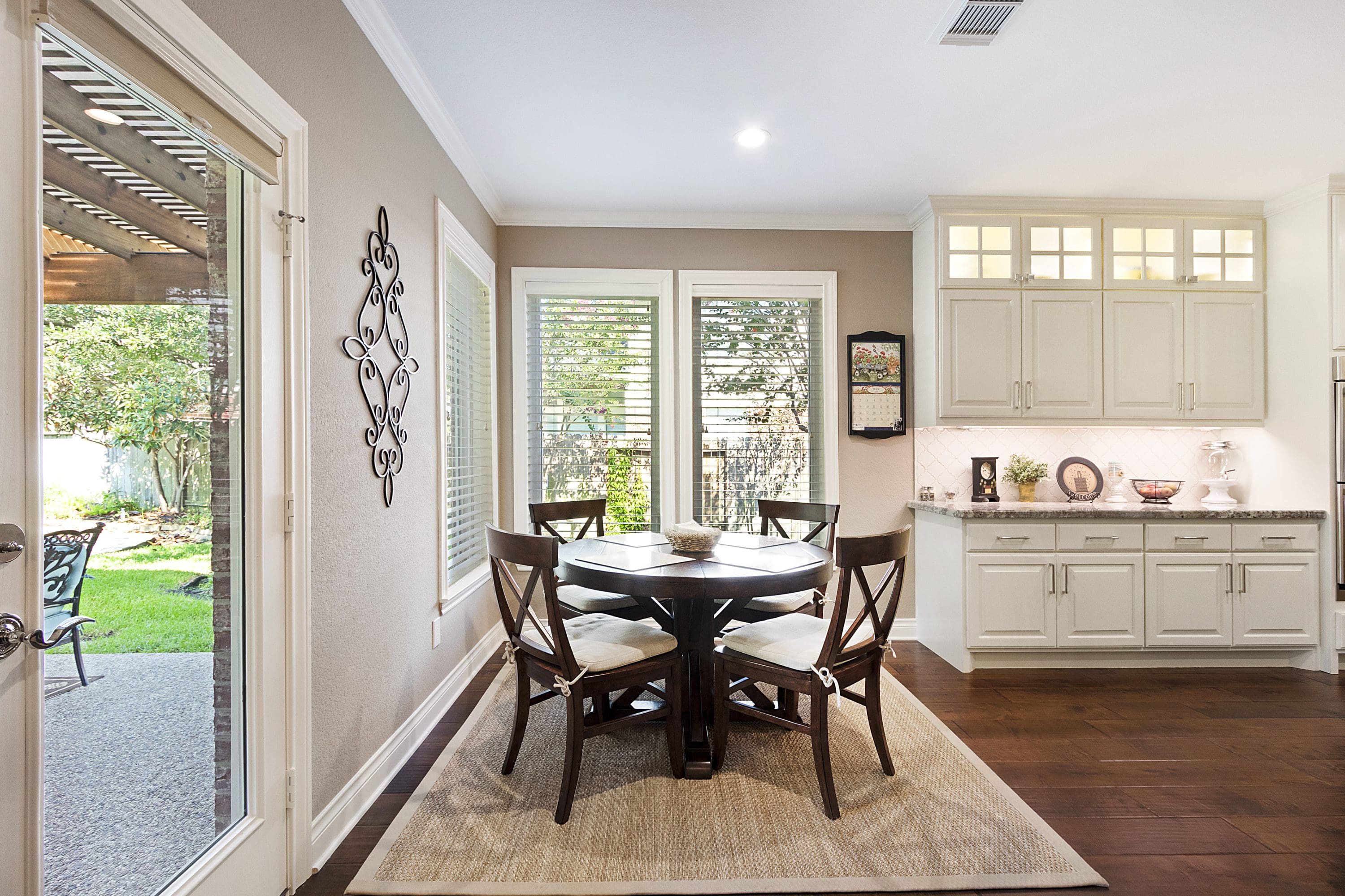 A dining room with a table and chairs in it