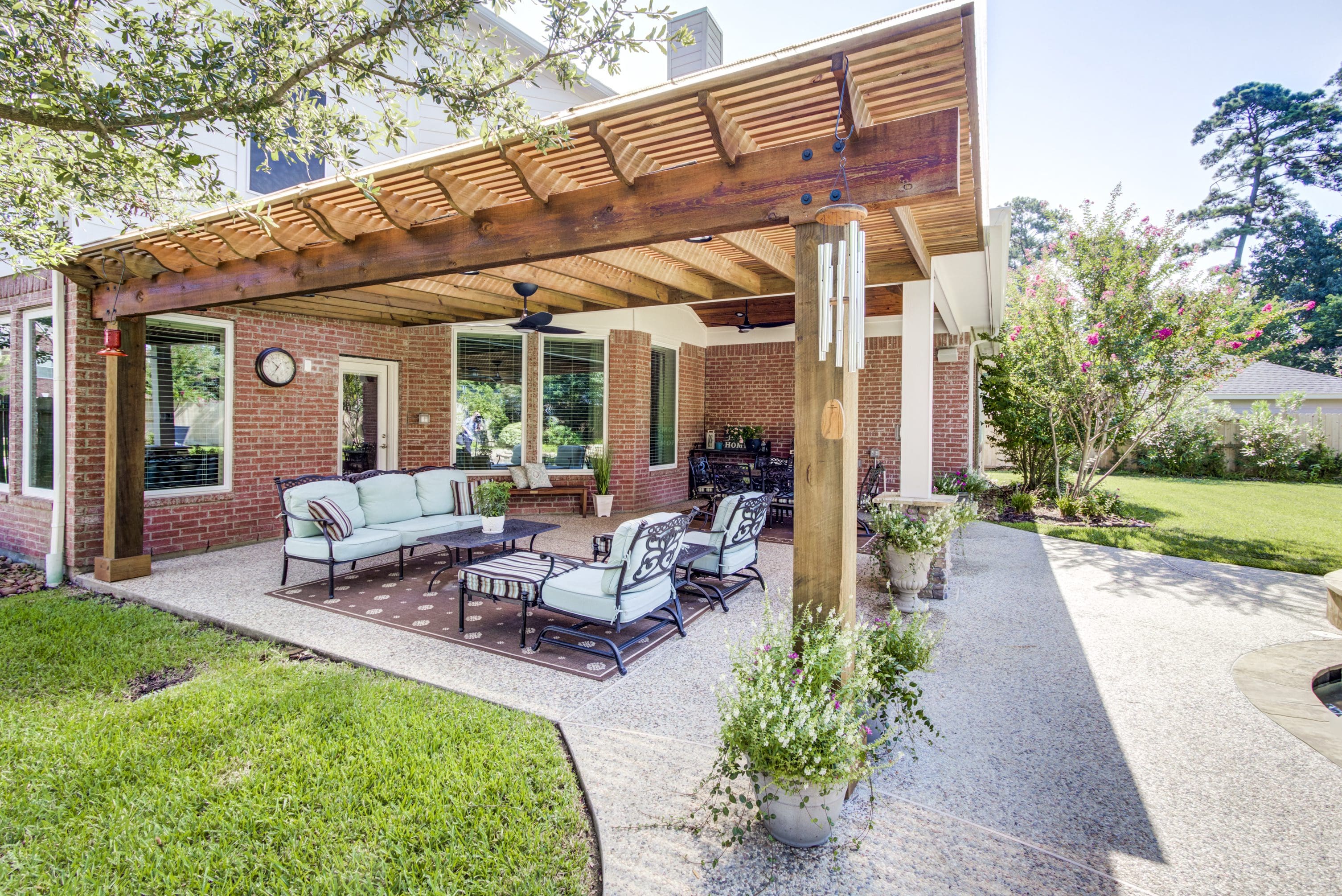 A patio with furniture and a fire pit.