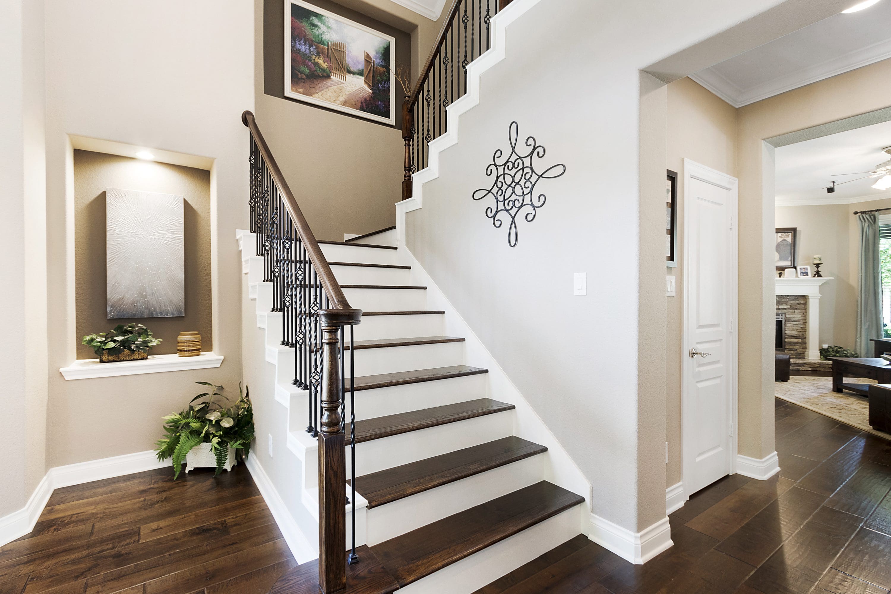 A staircase with wood steps and white walls.
