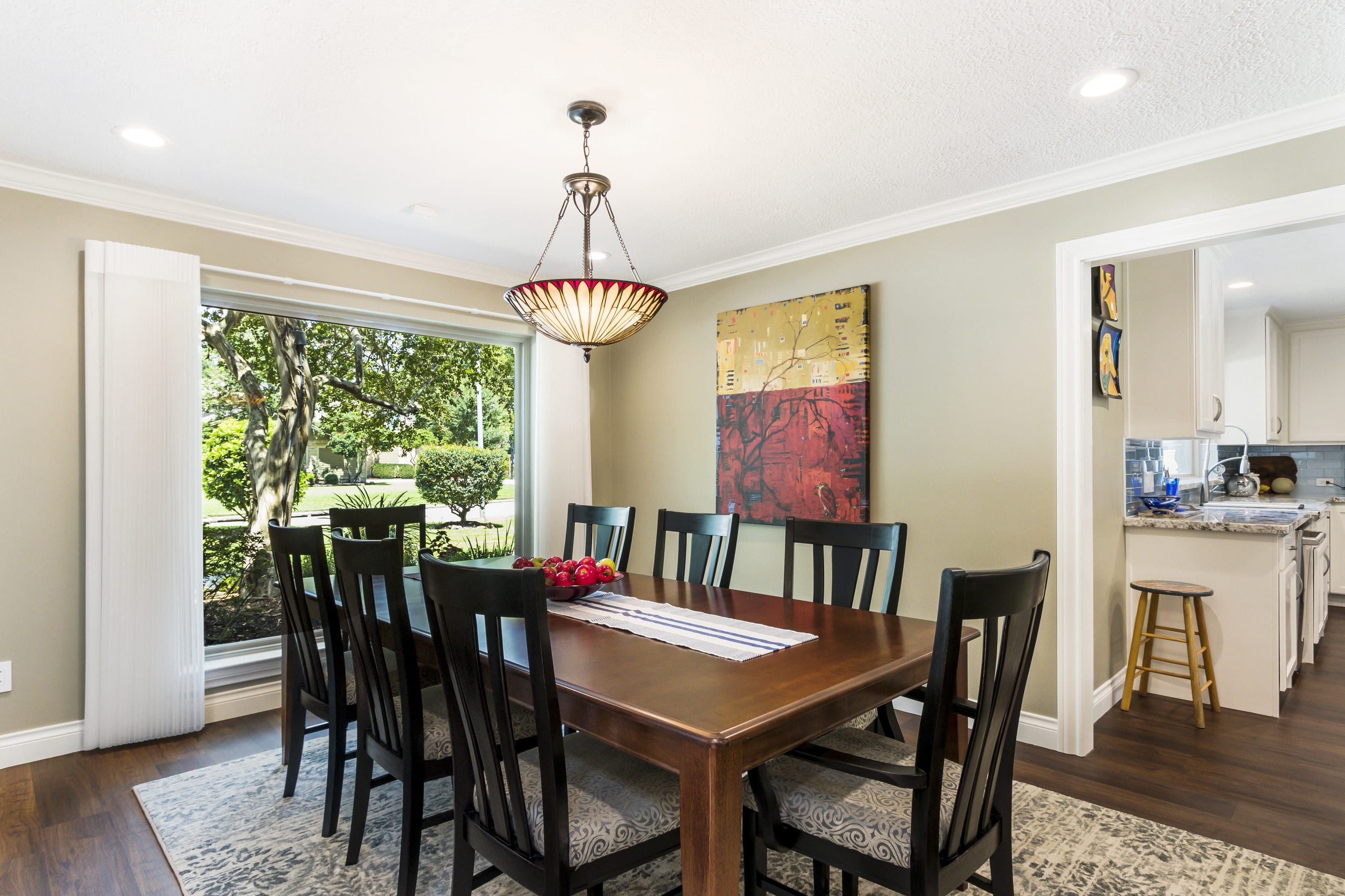 A dining room table with chairs around it