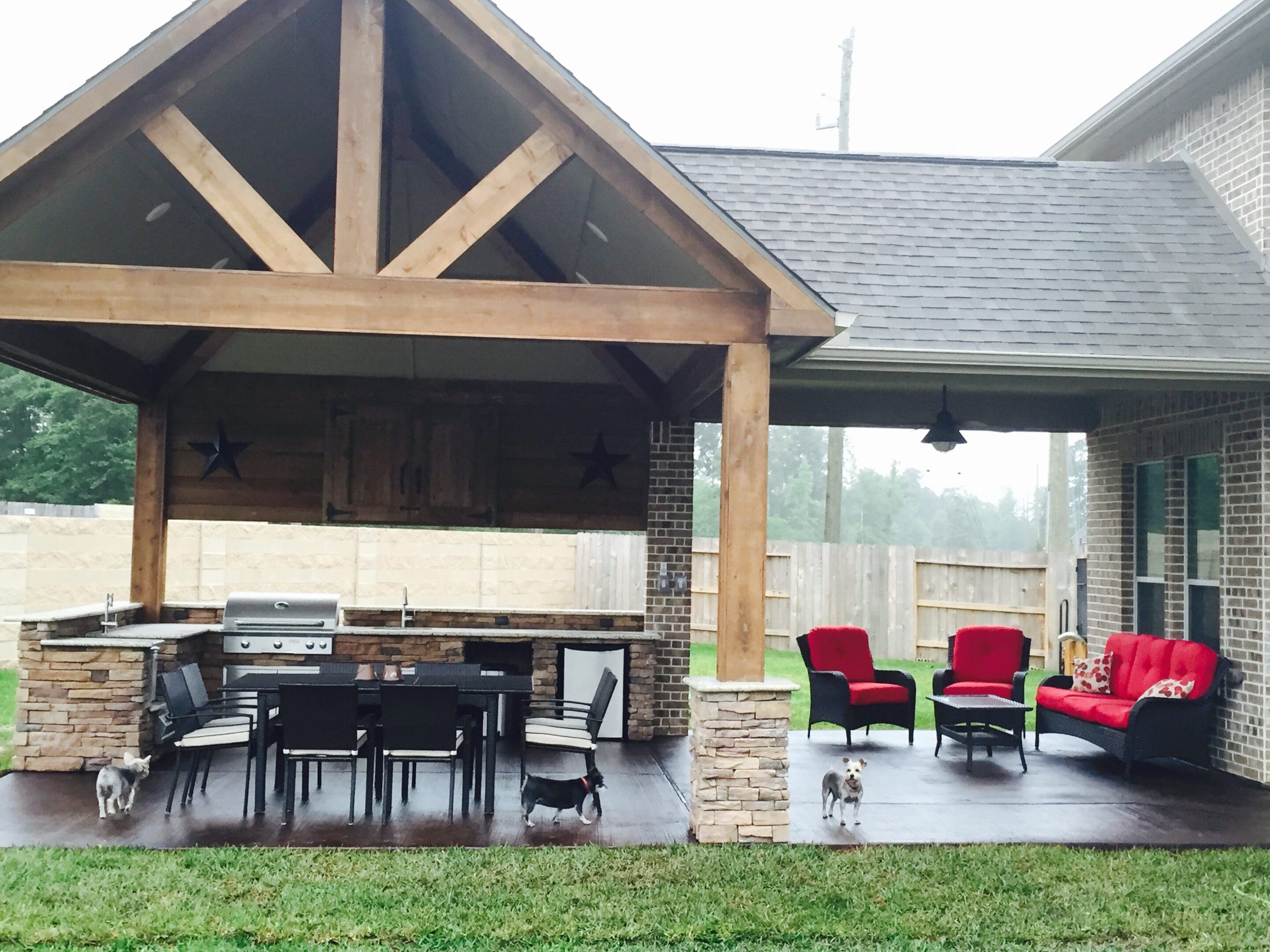 A covered patio with chairs and tables in it