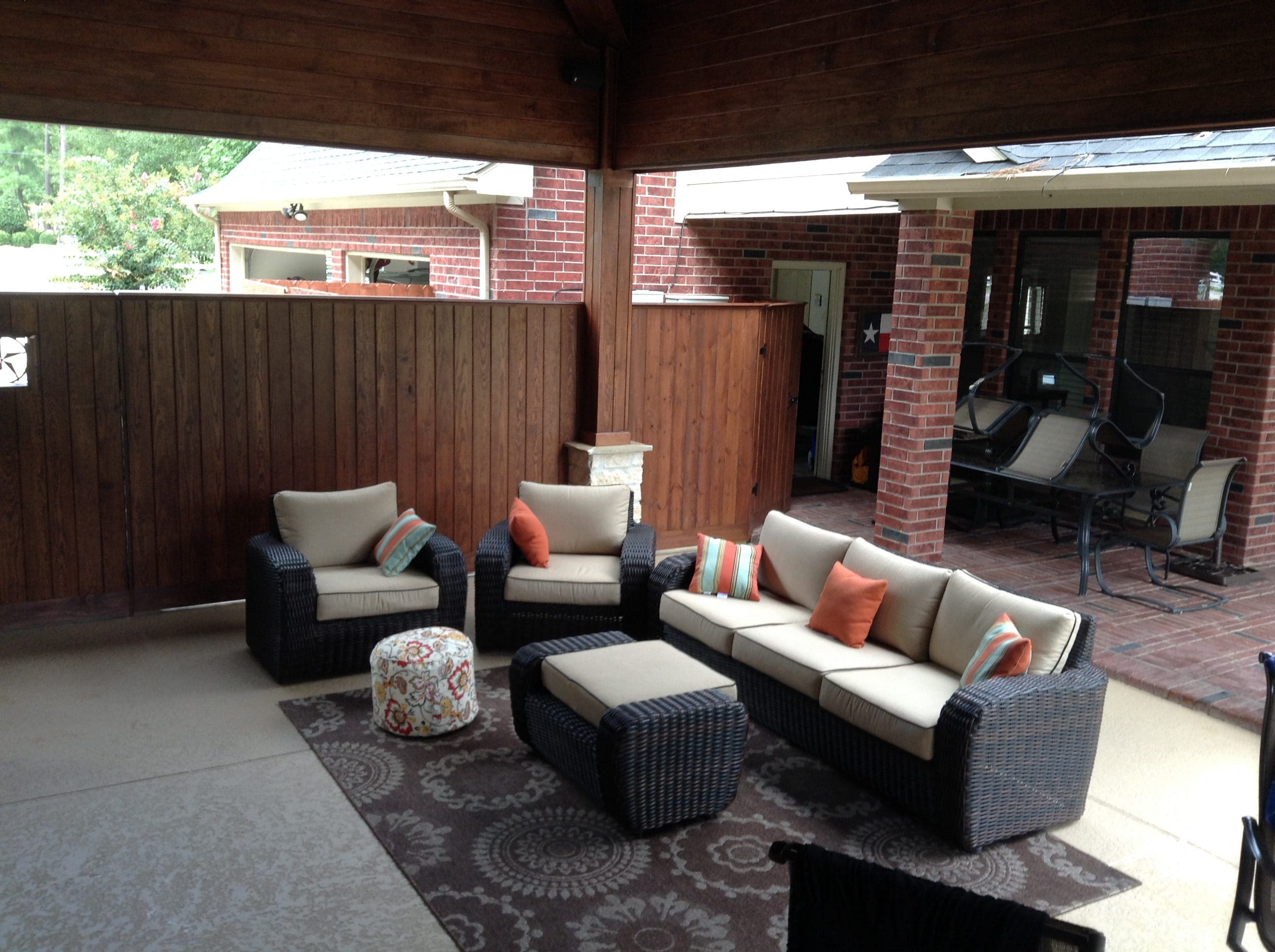 Photo Aug 09, 4 38 14 PM A patio with furniture and a fire pit.