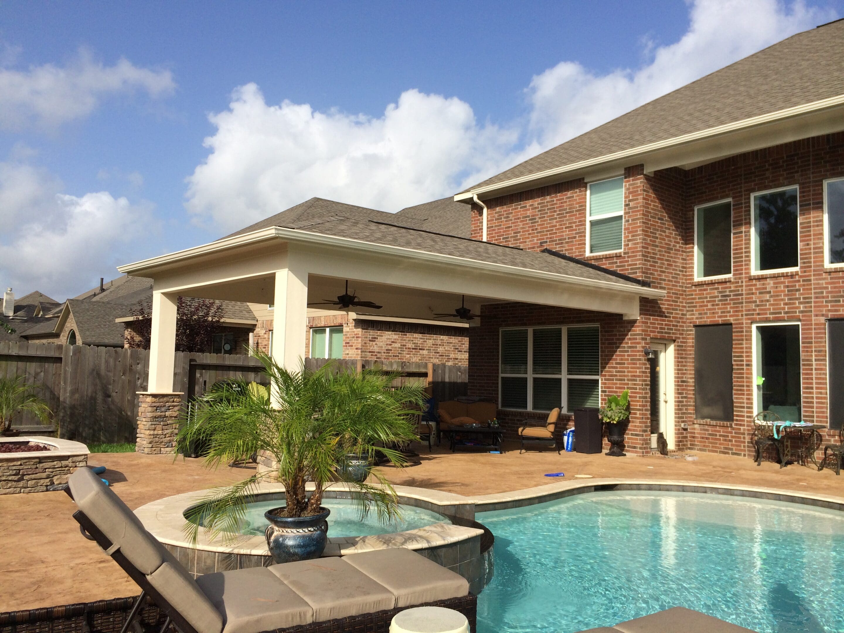 A pool and patio area with a gazebo.