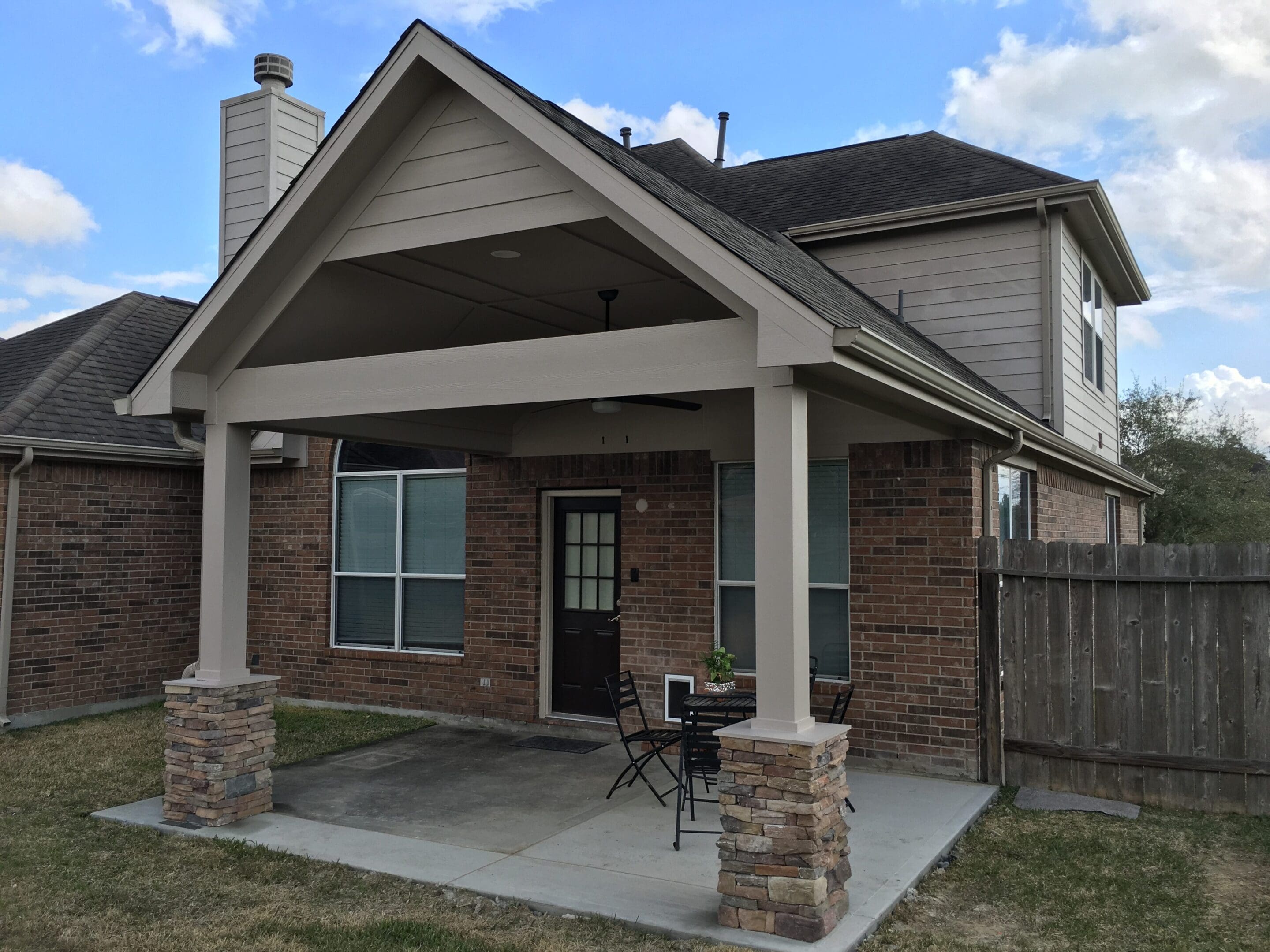 A house with a porch and patio area.