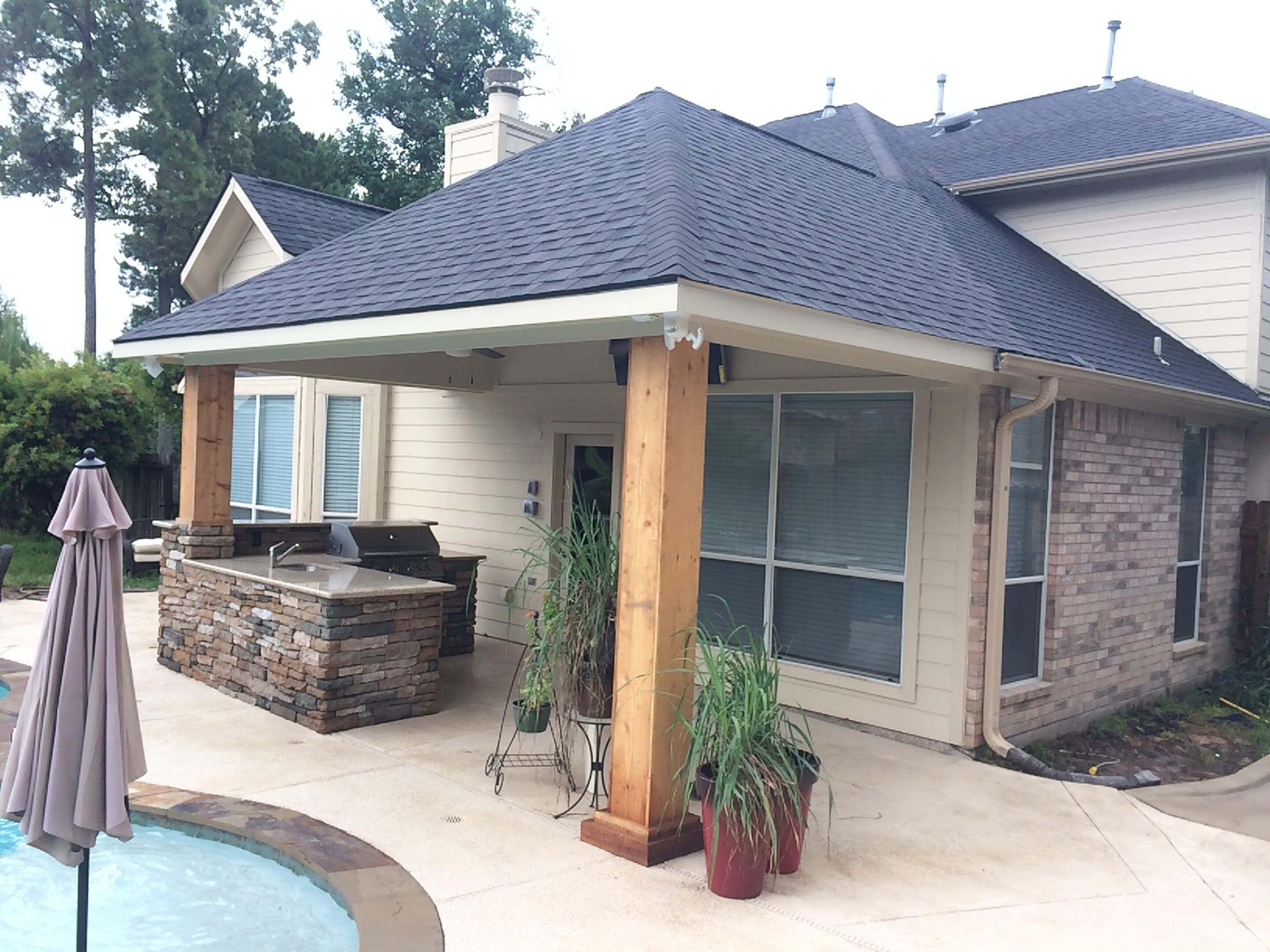 A house with a pool and patio area