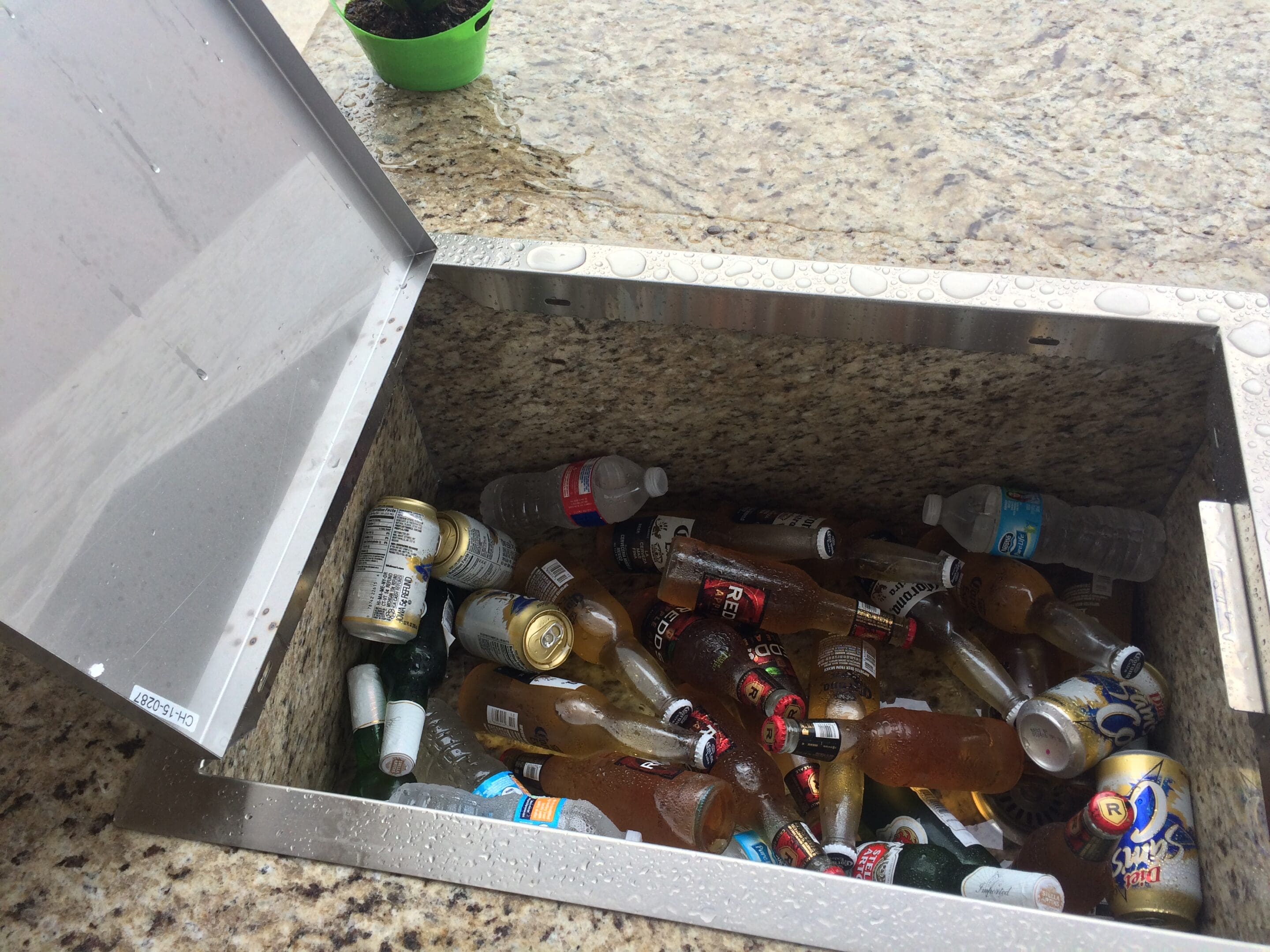 A box of beer is open on the counter.